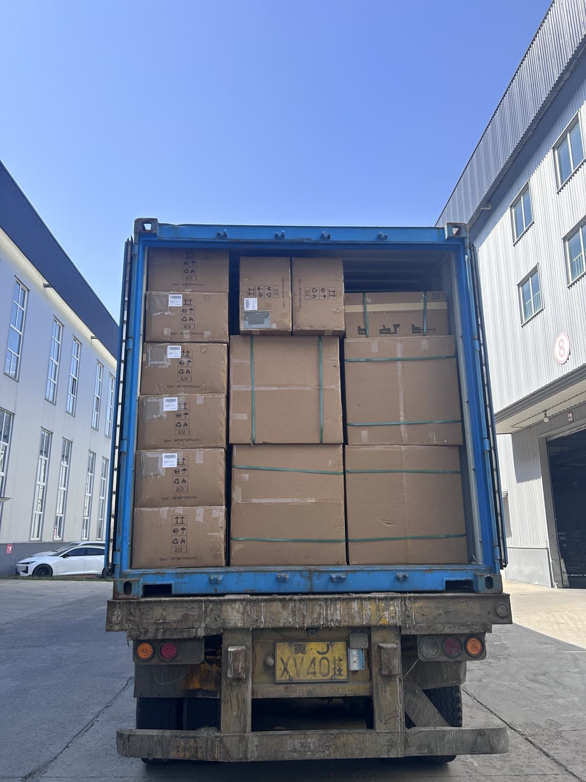 Loaded cartons of customized LD-1A80 sofa beds inside the container